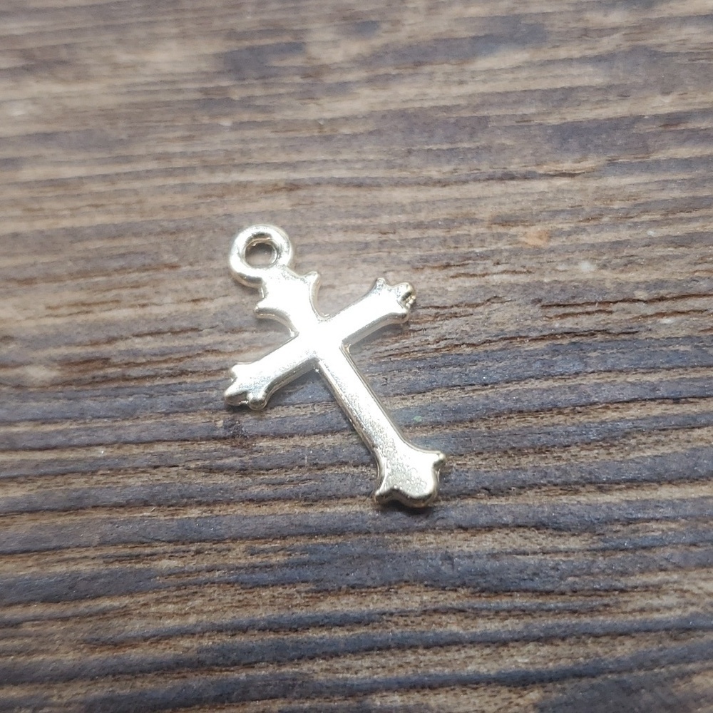 P115 gold tone cross charm
